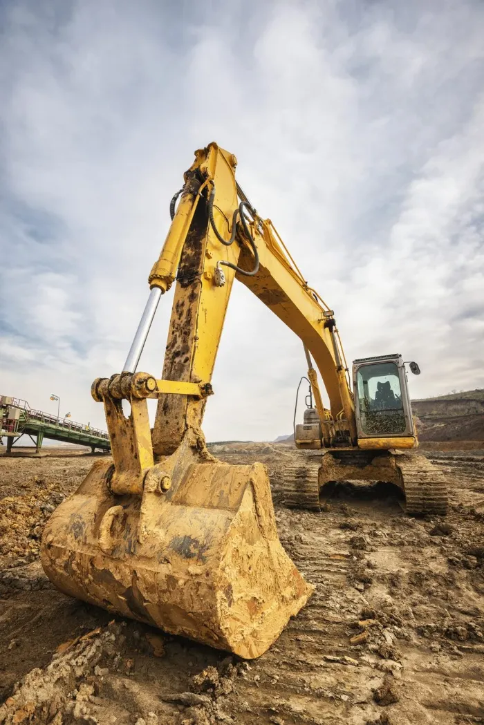 groundworks london excavator moving earth on construction site